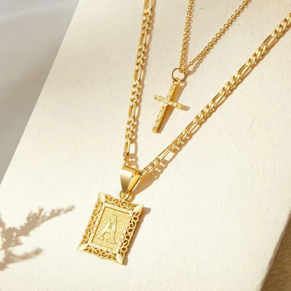 Set de Collar con Inicial y Cruz | Oro