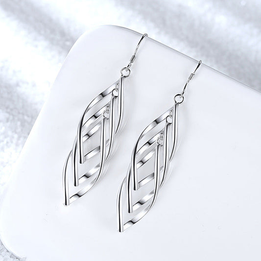 Solenne Aretes Onda Tejida | Oro Blanco